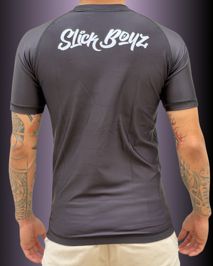 Back view of SlickBoyz rash guard in the color black